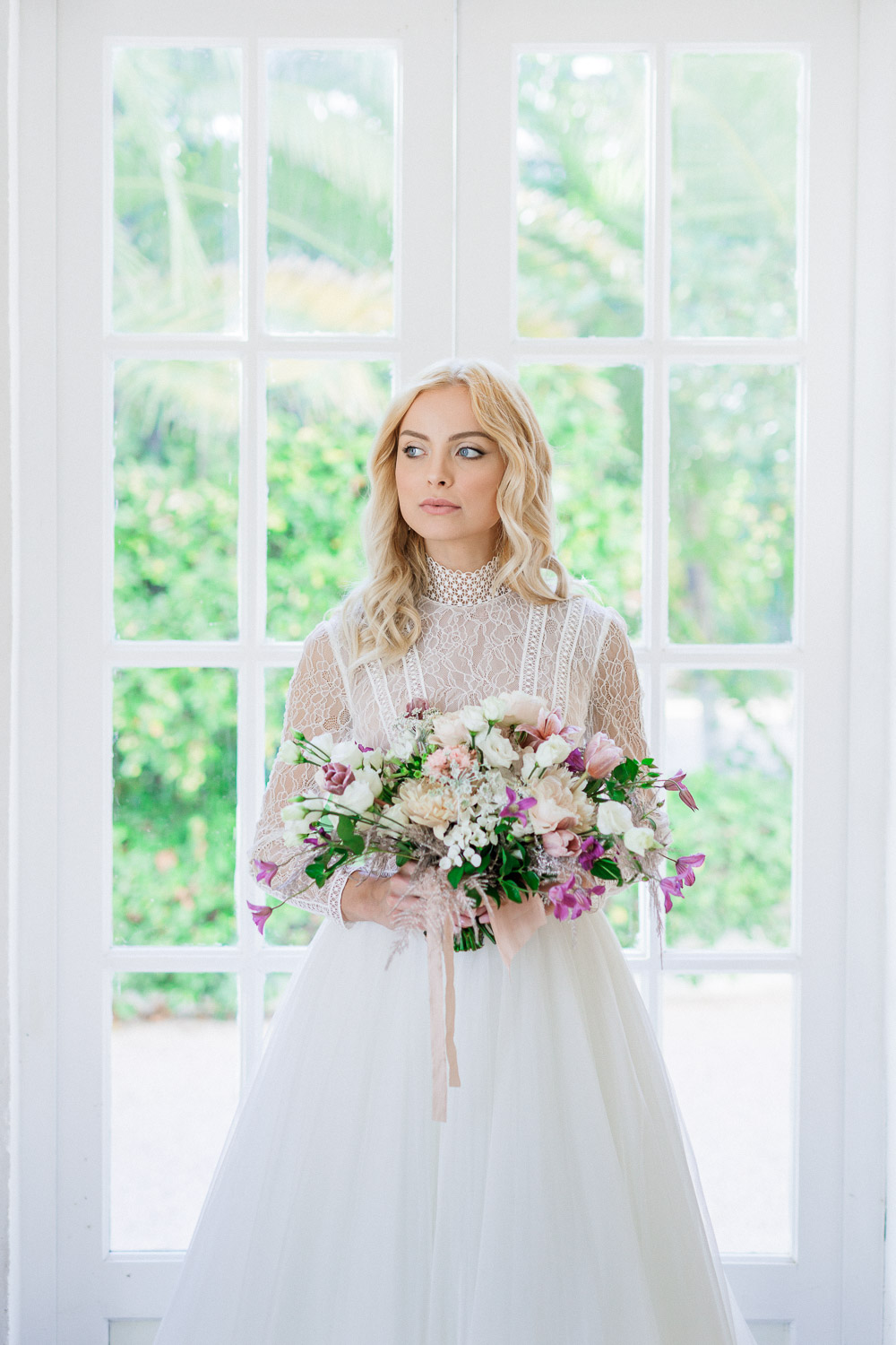 the bride with her bouquet and the dress