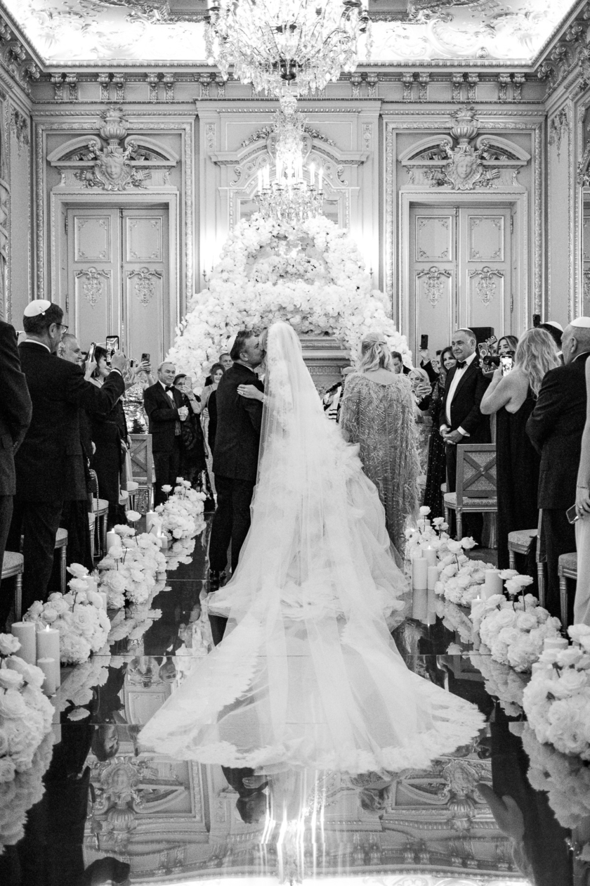Bride and groom during a luxury wedding ceremony at a Parisian palace, captured by Olivier Neuville Photography.