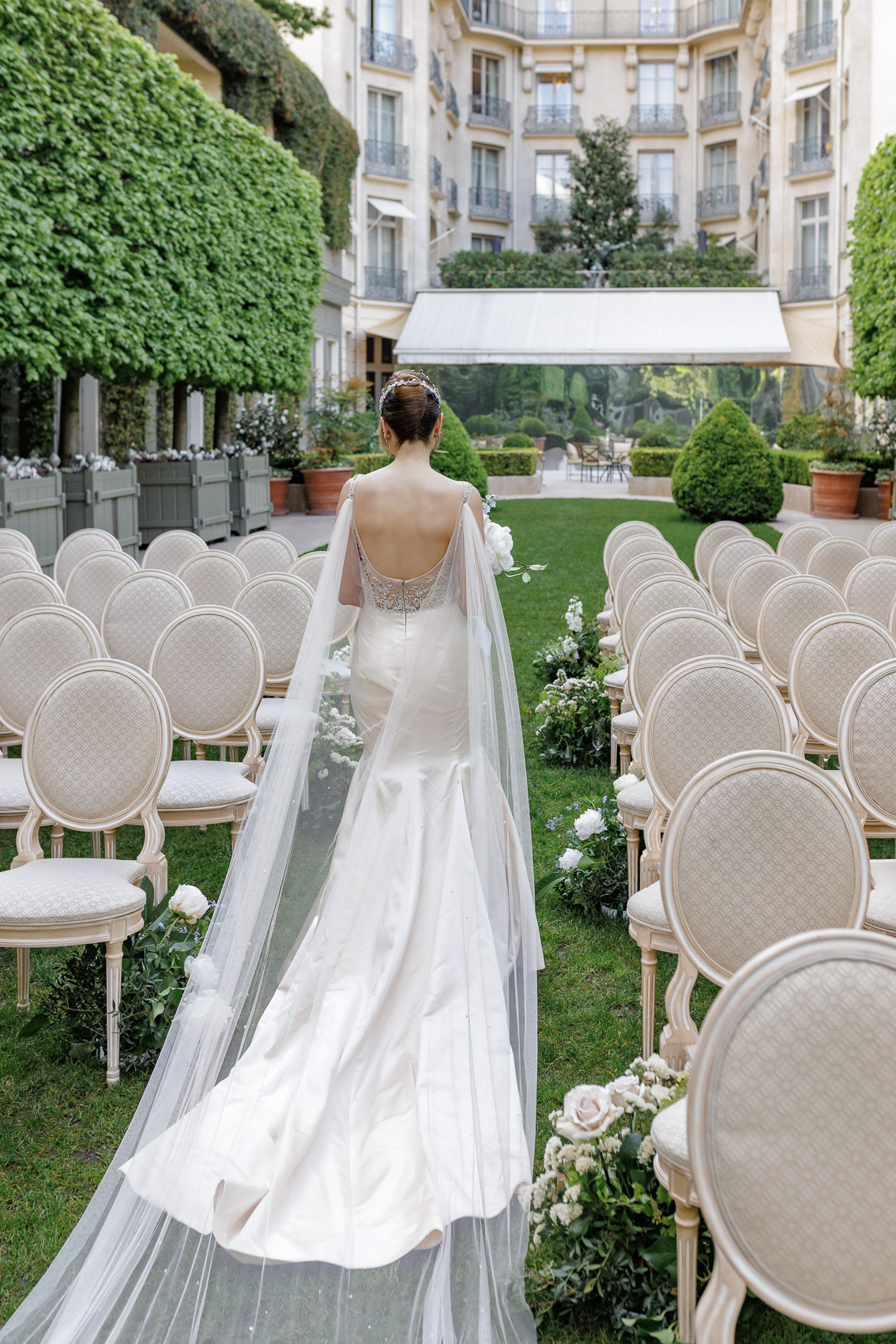 Bride in the Ritz Paris garden, a picturesque and romantic setting