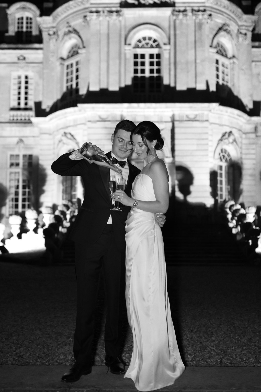 Night photo session outside Château de Champlâtreux, capturing the magical ambiance.