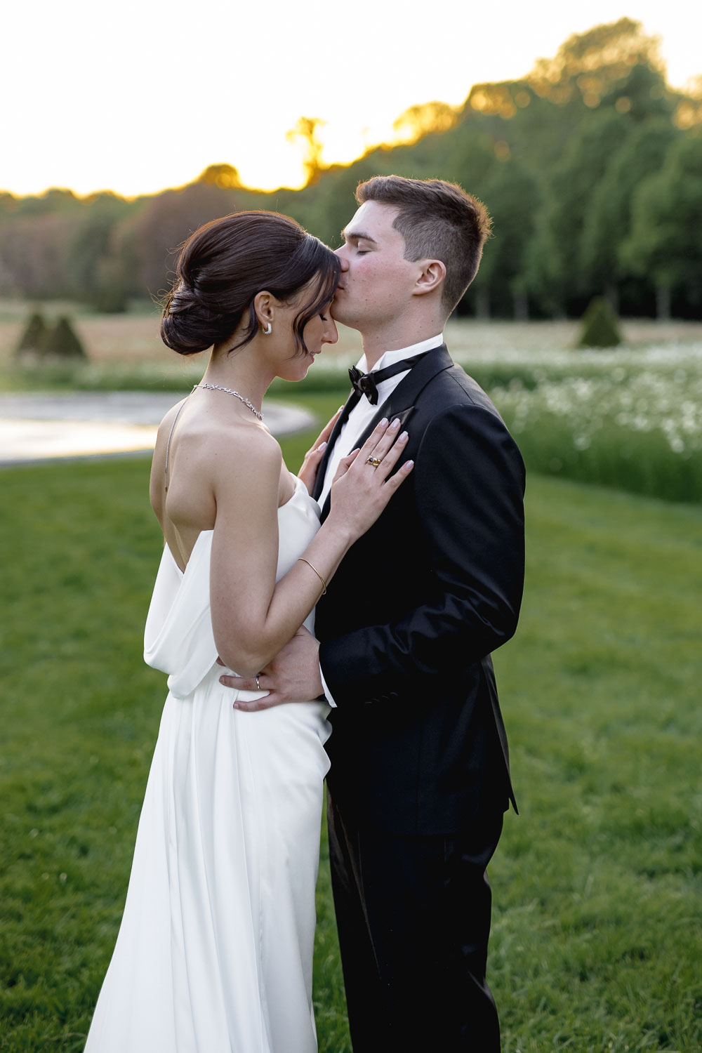 ouple photo session in the picturesque gardens of Château de Champlâtreux.